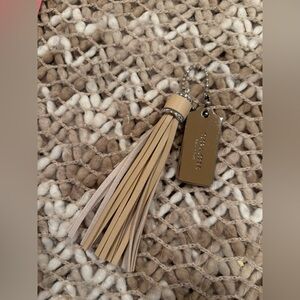 Coach Silver Hangtag with Chic Beige Tassel Keychain